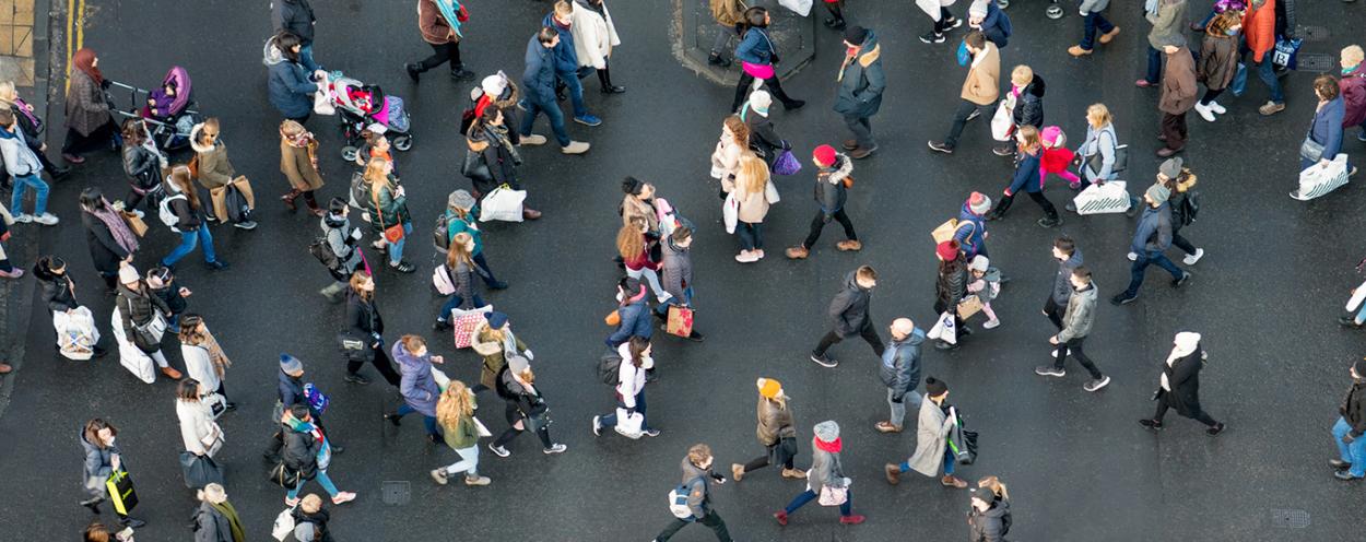 Crowd of people walking in street